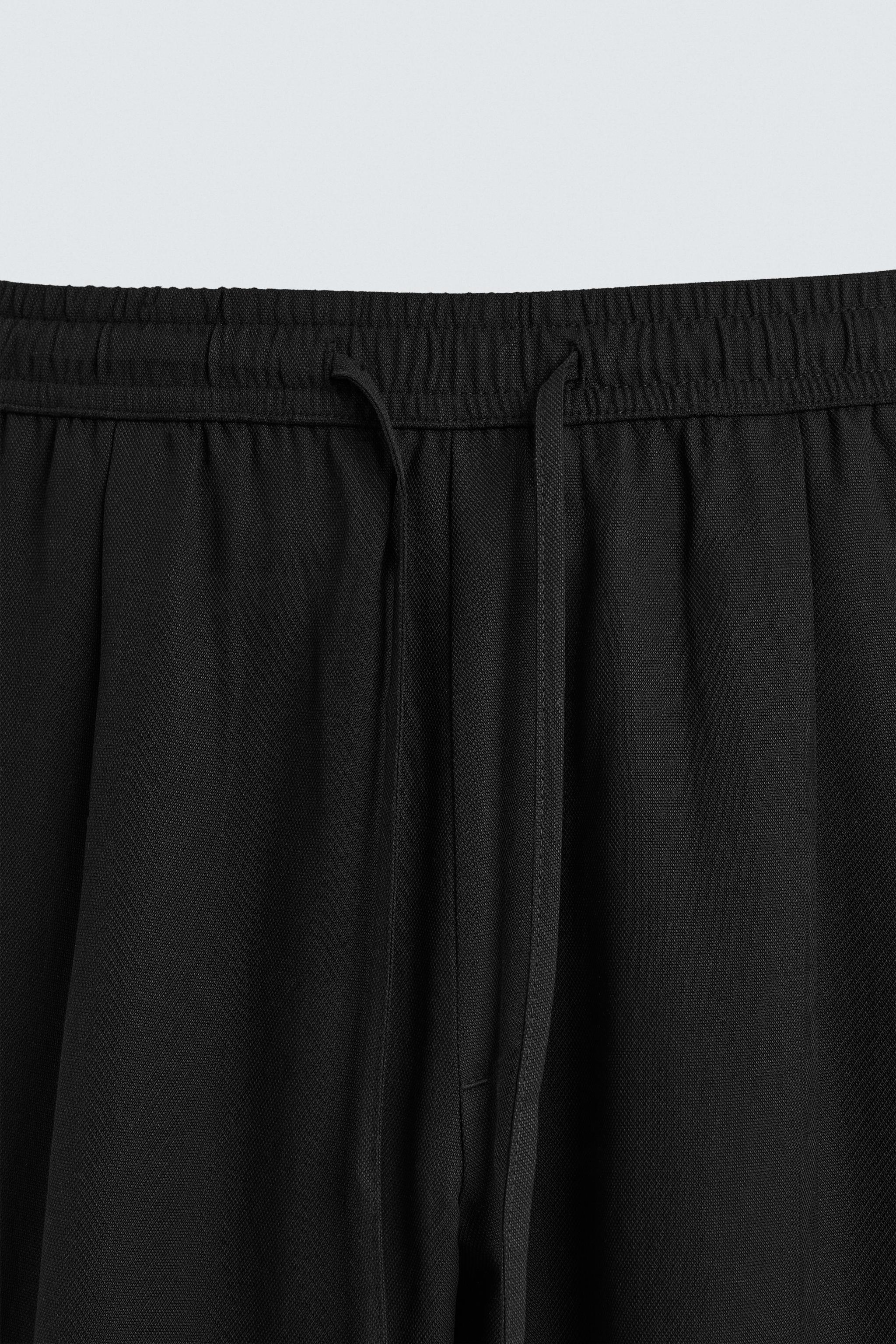 RELAXED FIT FLOWY PANTS